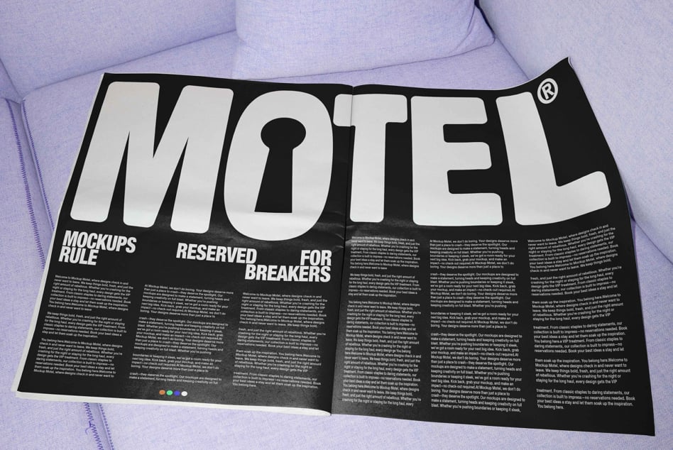 Motel magazine opened flat on purple couch displaying bold keyhole logo