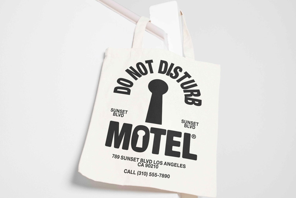 Natural cream canvas tote with Do Not Disturb Motel keyhole design in black