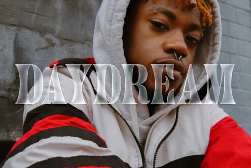 Young person wearing a hoodie, with bold DAYDREAM text overlay. Stylish urban aesthetic, typography, fashion design, graphic template for creative projects.