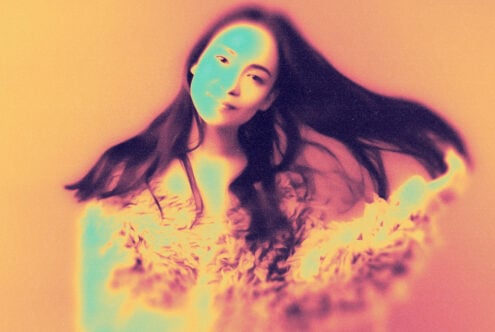 Psychedelic portrait of a woman with flowing hair and abstract colors; ideal for graphic design, art inspiration, digital assets, creative templates.
