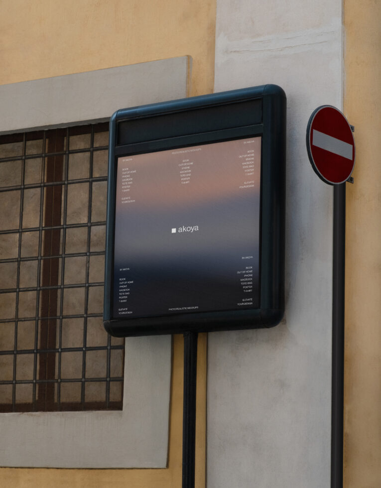 Black rounded tablet mockup on wall next to red no entry sign with grid window