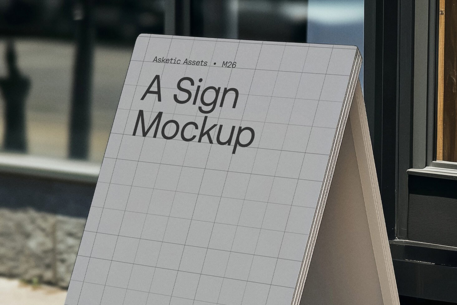 Outdoor sign mockup with grid design displayed on a sidewalk. Ideal for showcasing branding graphics and templates. Perfect for graphic designers.