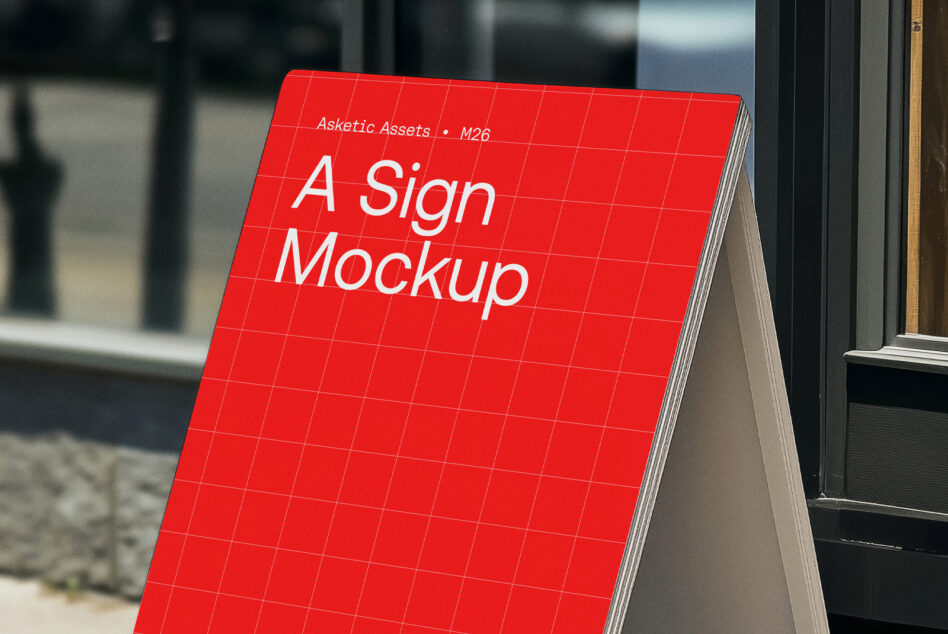 Red A-frame sign mockup angled toward camera on pavement