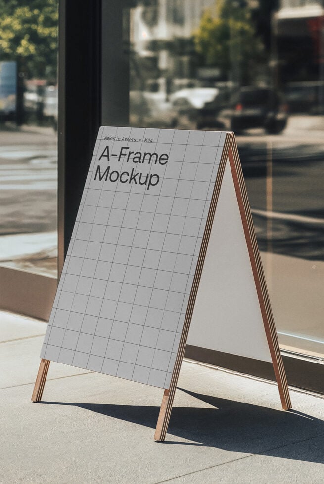 A-Frame Mockup featuring a wooden sandwich board on an urban sidewalk, perfect for showcasing graphic designs, templates, outdoor advertising, signage.