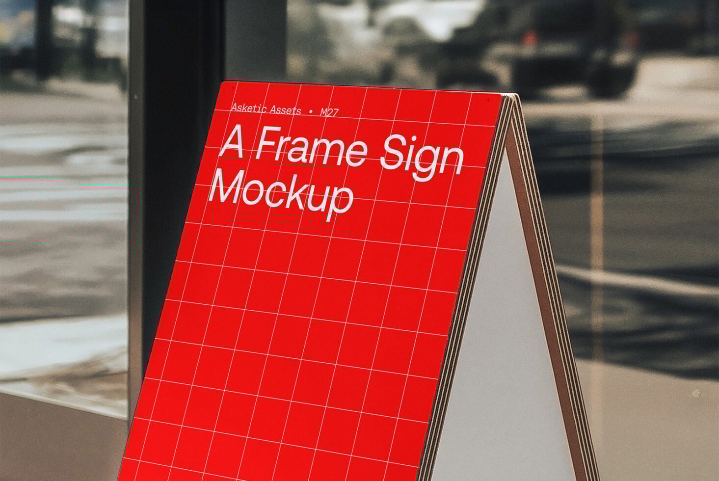 Red A-frame sign mockup with grid design. Perfect for showcasing signage templates. Ideal for graphic designers in need of realistic mockup assets.
