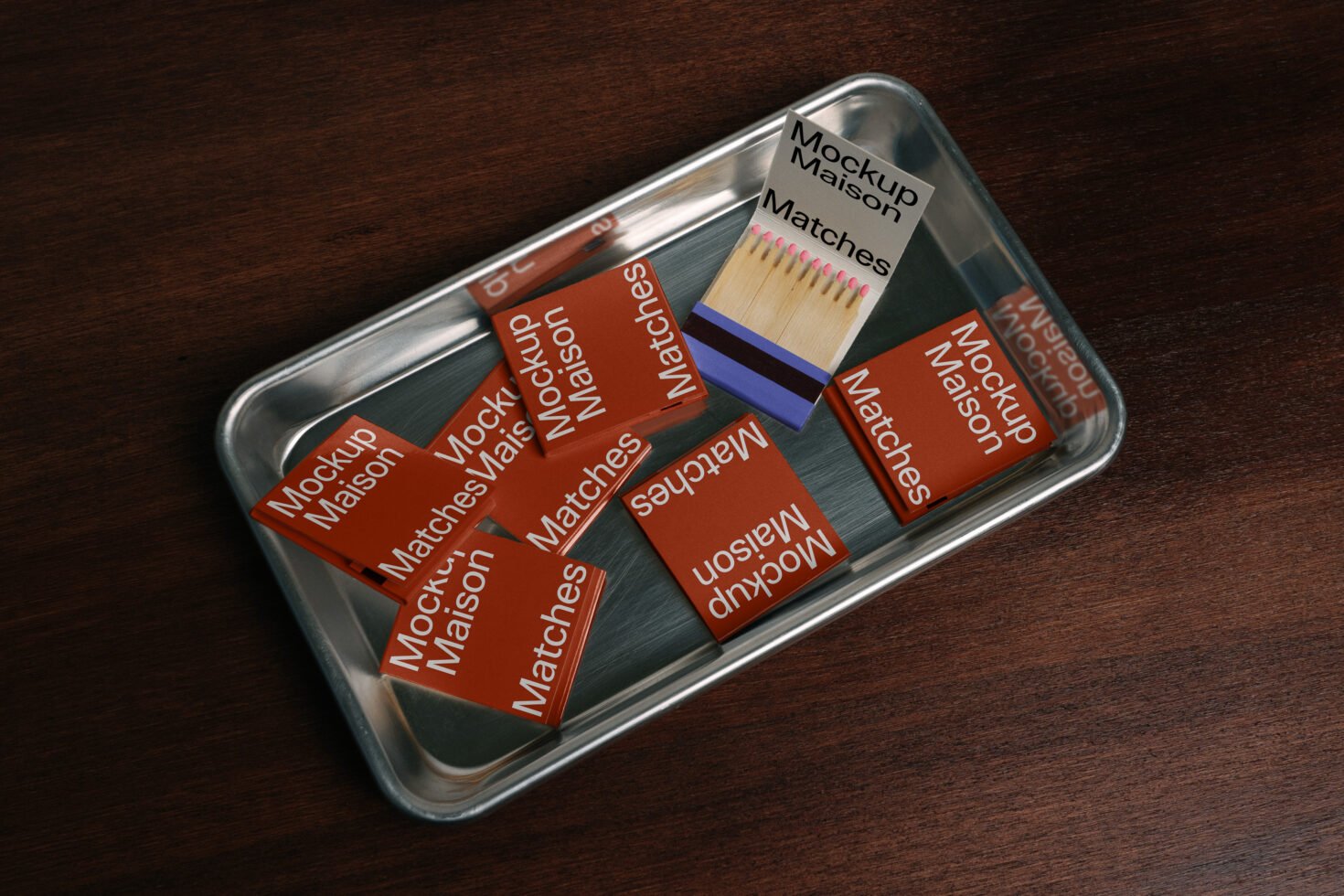 Matchbox mockup design on a metal tray with red matchbooks labeled Mockup Maison on wooden background perfect for branding templates and graphics.