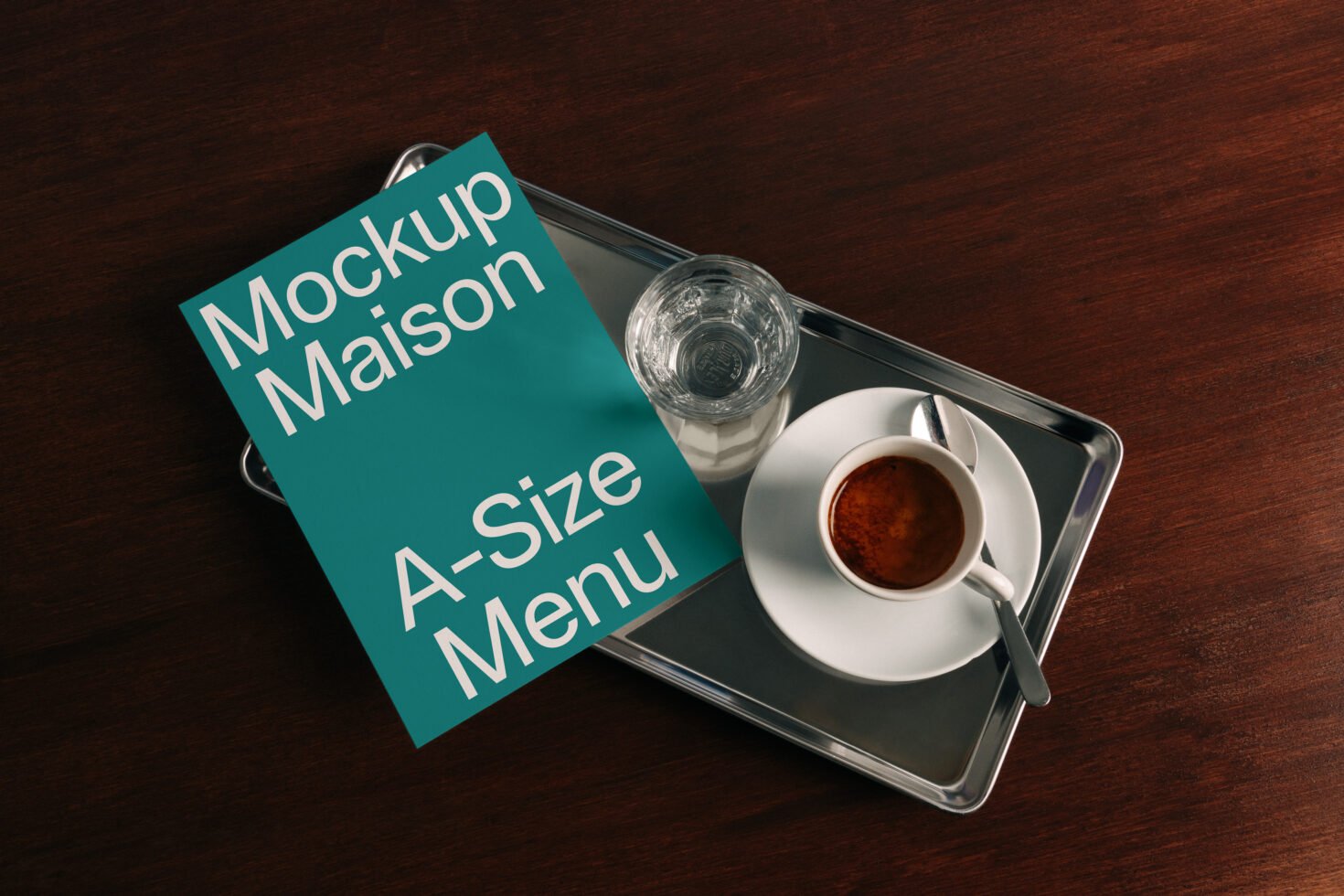 A-size menu mockup on a dark wood table next to coffee and water on a tray ideal for showcasing restaurant menu designs and templates for designers