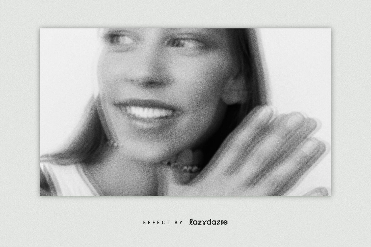 Blurry vintage style black and white photo effect with a smiling female model. Ideal for creating retro graphics or artistic photo templates for designers.