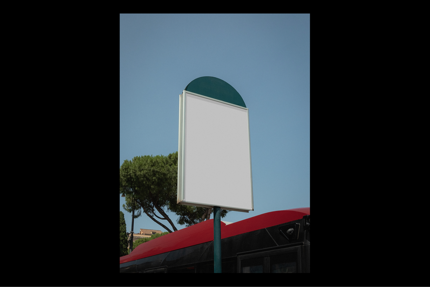 Bus stop sign mockup against blue sky and trees ideal for designers. Blank placeholder for advertising graphics urban signage template city design.