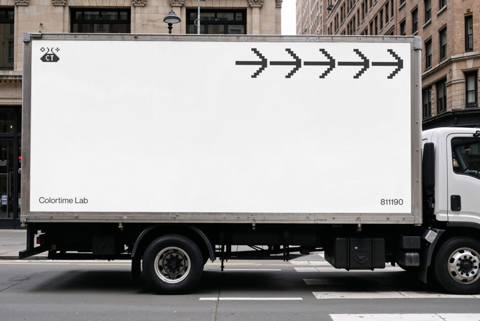 White truck side with pixel arrows, street storefront background