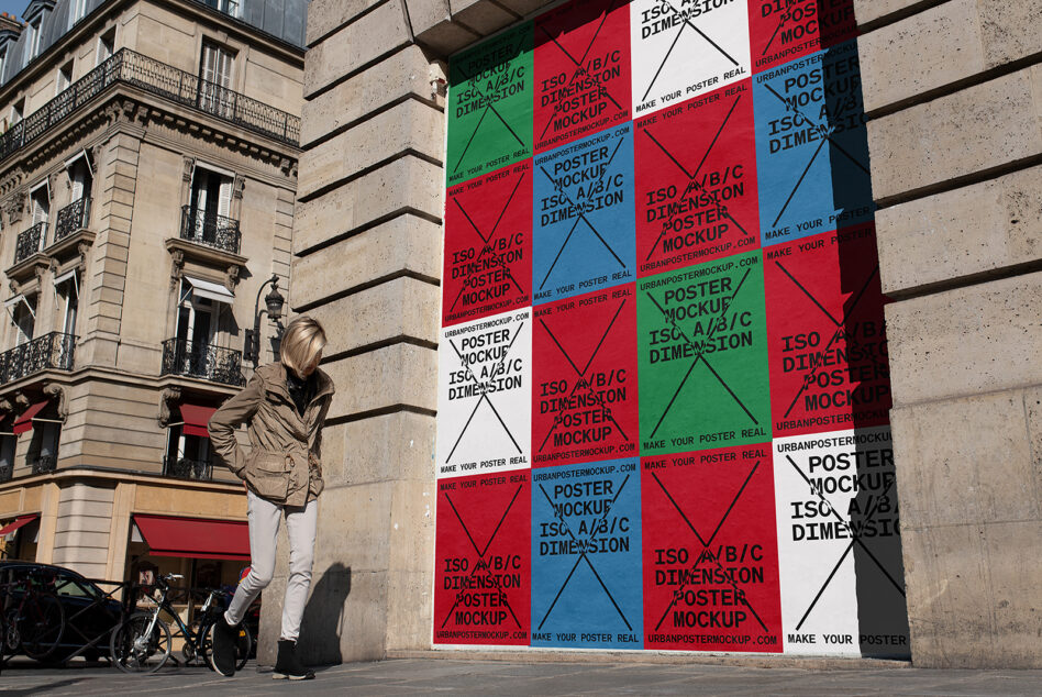 Large red blue green white poster mockup on Paris building facade with cyclist