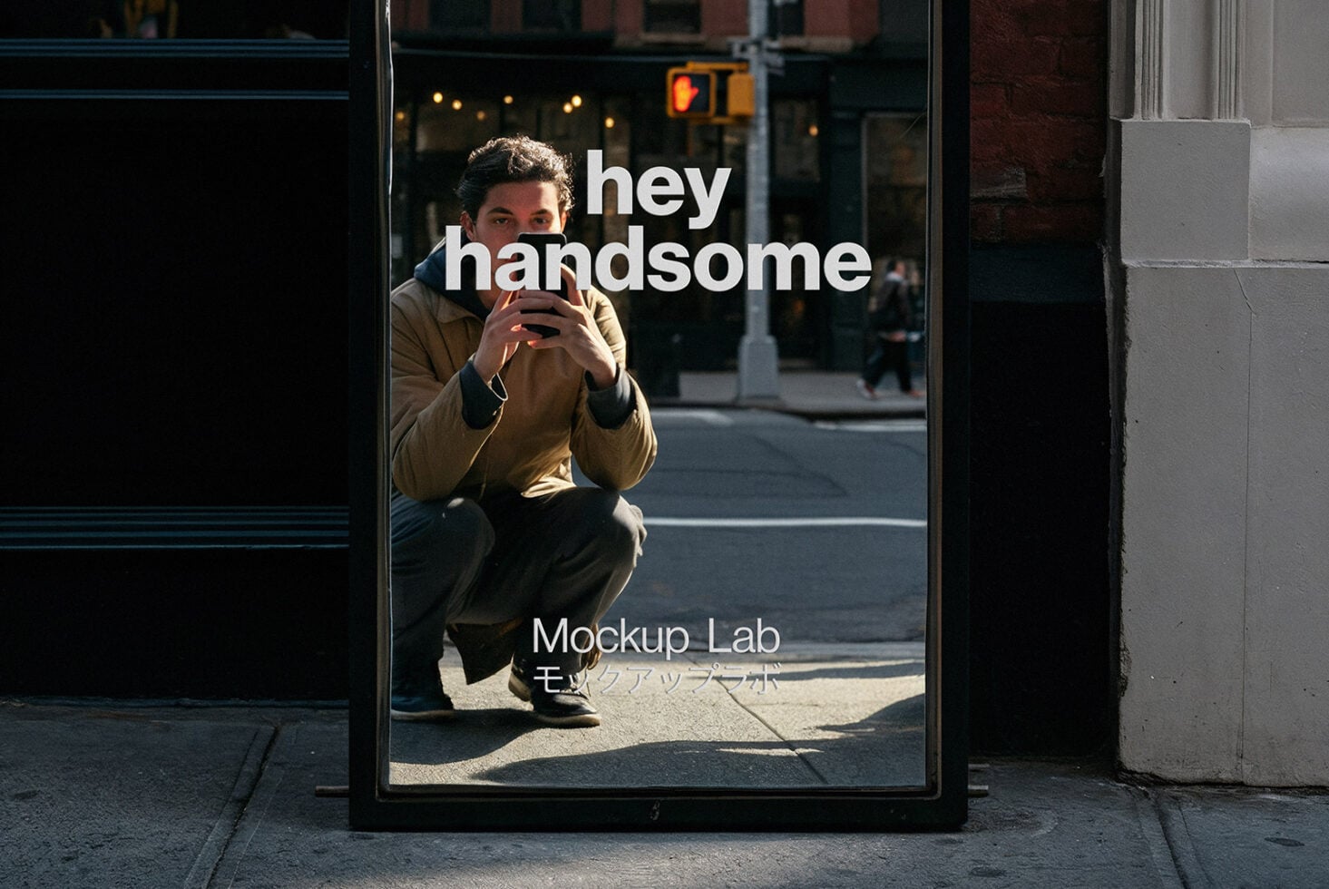 Street window poster showing guy holding phone with hey handsome text overlay