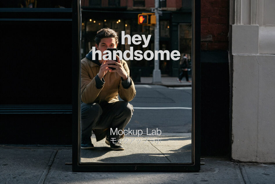 Street window poster showing guy holding phone with hey handsome text overlay