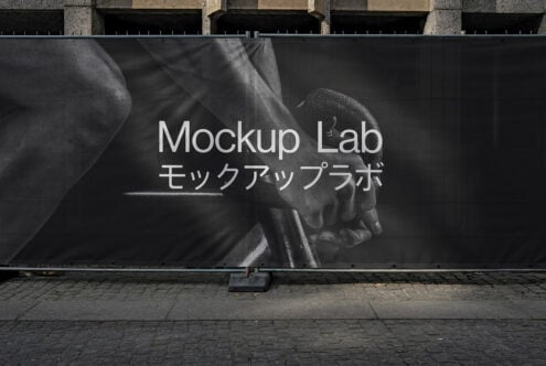 Large outdoor dark billboard mockup with white typography in urban setting