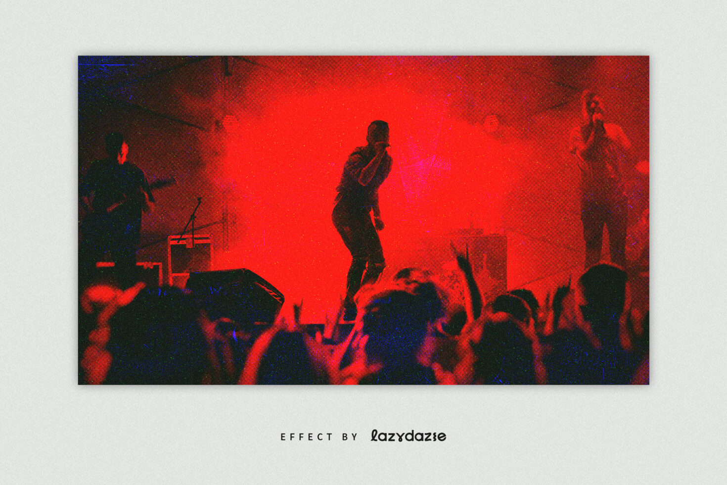 Live concert stage bathed in red light with band performing to crowded audience