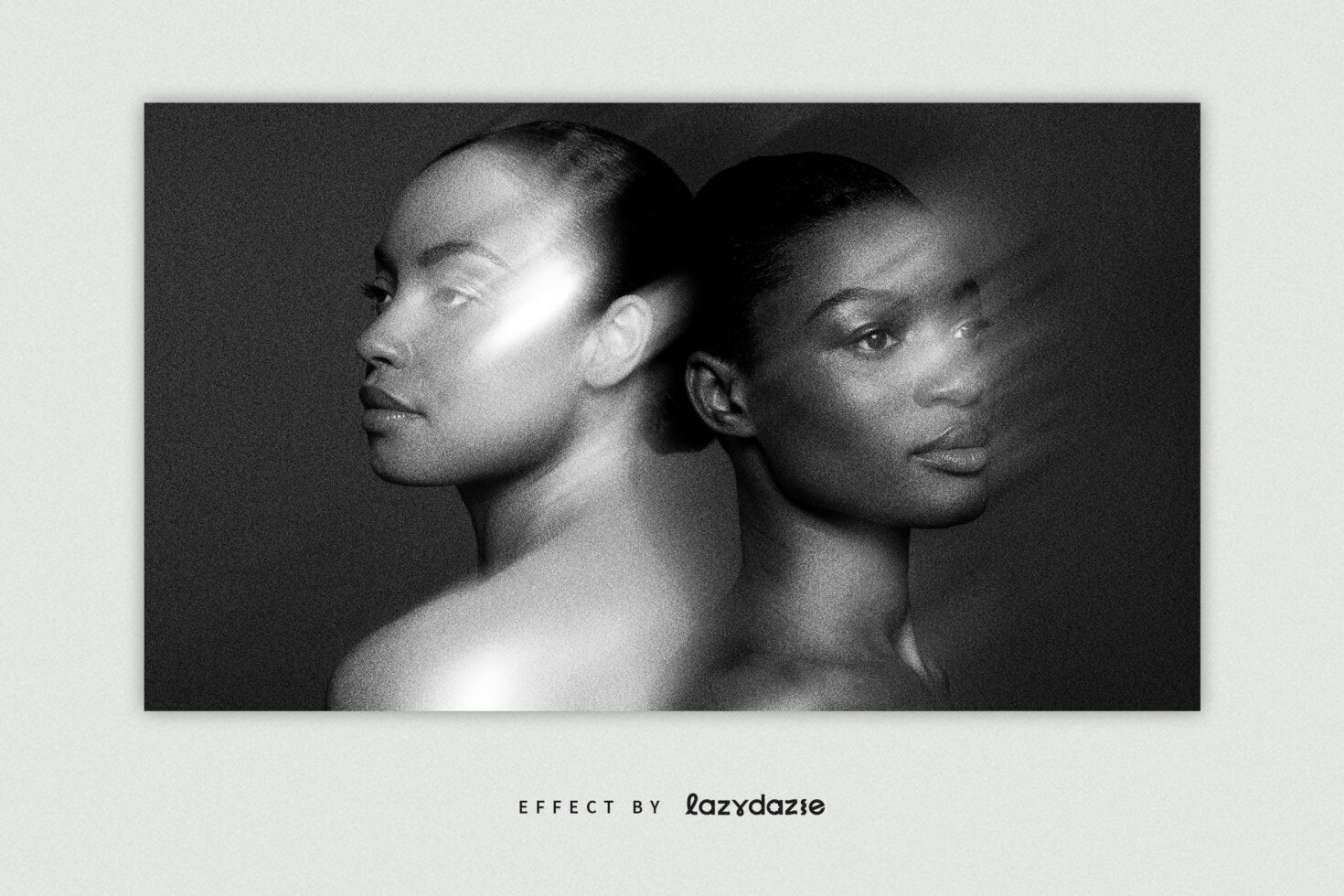 Two people back to back black white side profile studio portrait