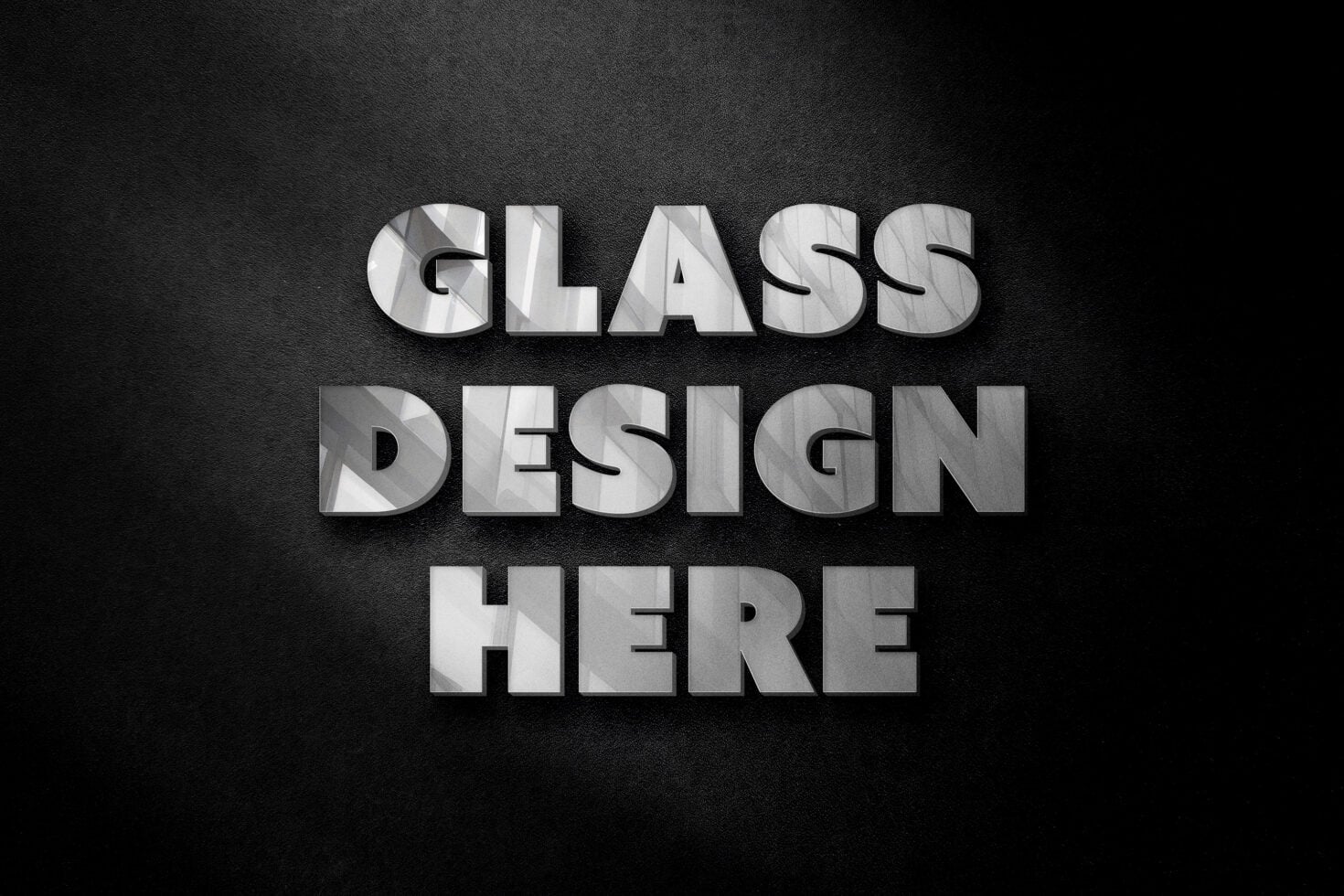 Bold glass effect text saying GLASS DESIGN HERE on dark fabric texture