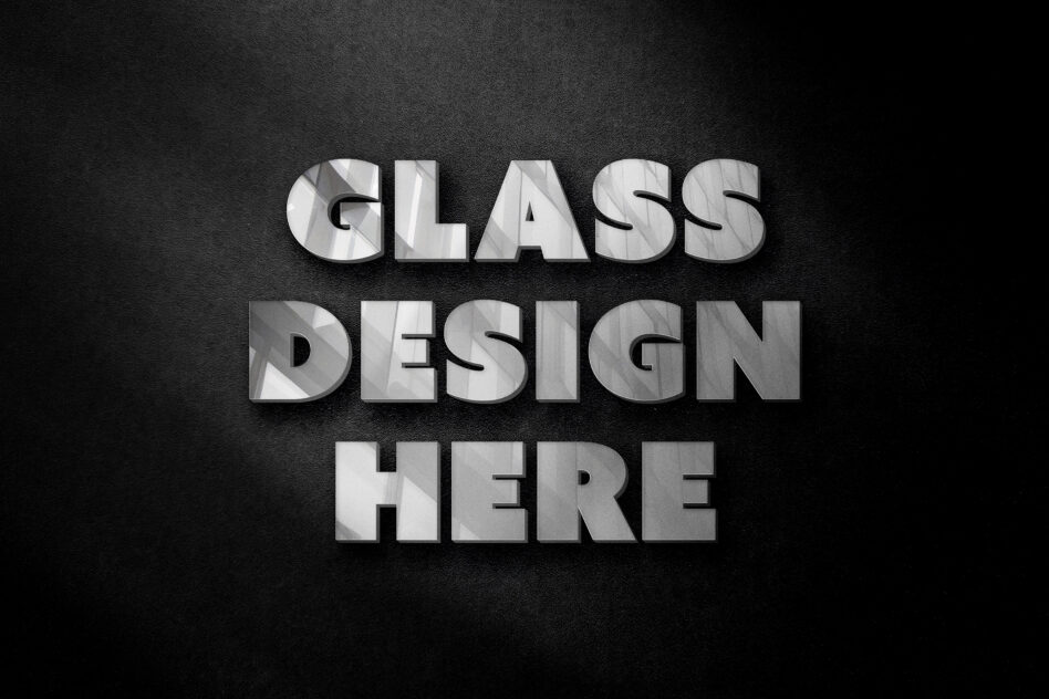 Bold glass effect text saying GLASS DESIGN HERE on dark fabric texture