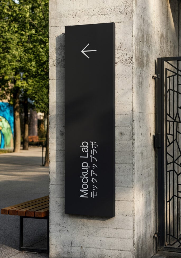 Tall vertical black sign with left arrow, Mockup Lab text below