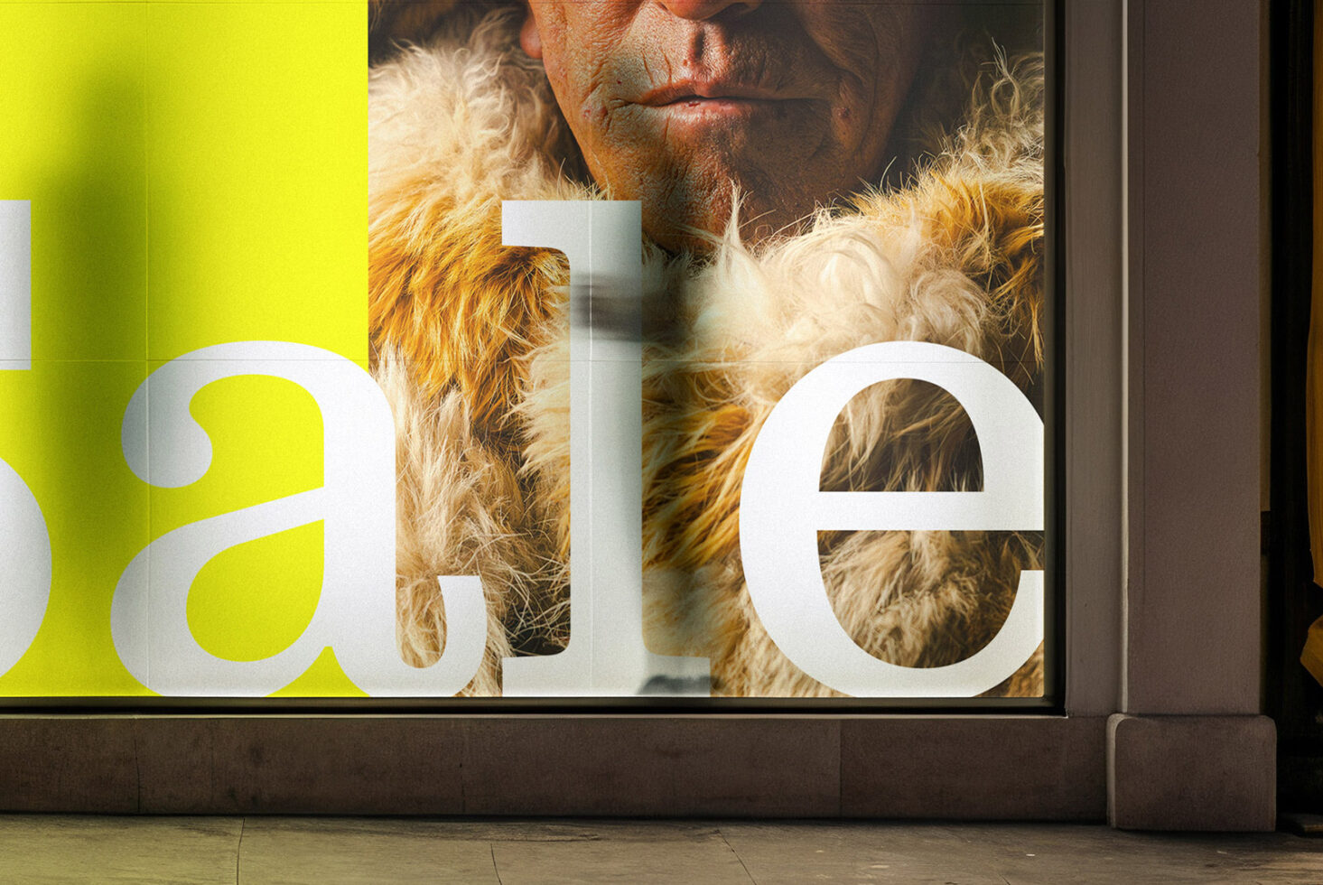 Large window display with neon yellow background showing bearded man in fur coat portrait