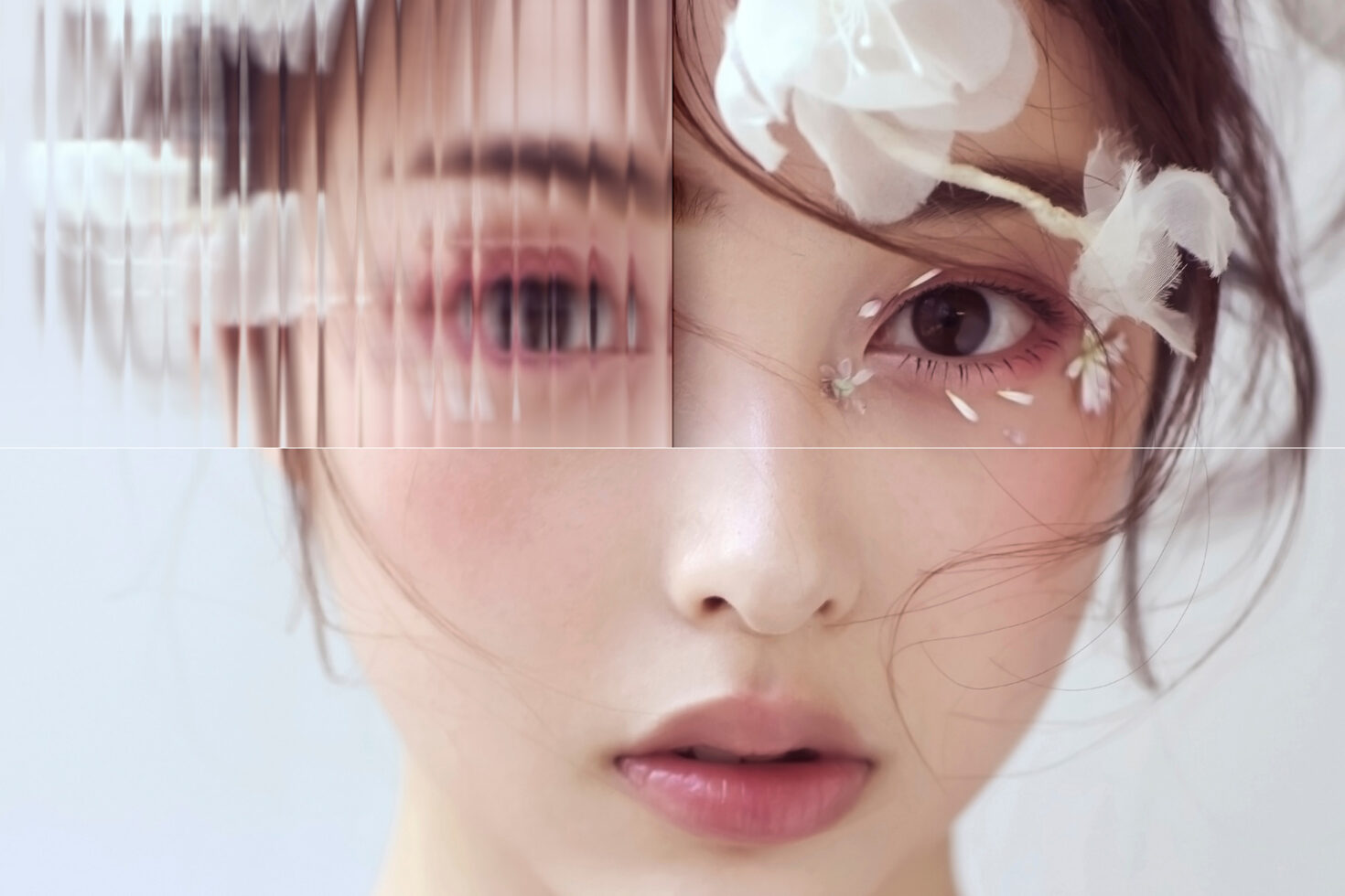 Pink toned face split with vertical line distortion effect throughout