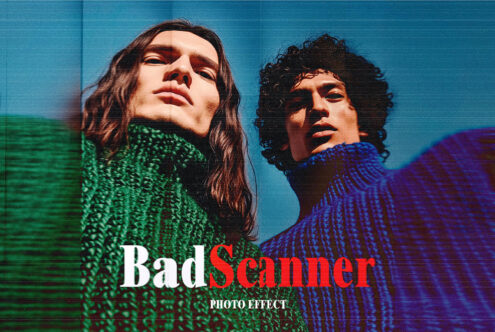 Two people tilting heads back on blue background wearing green blue knit sweaters