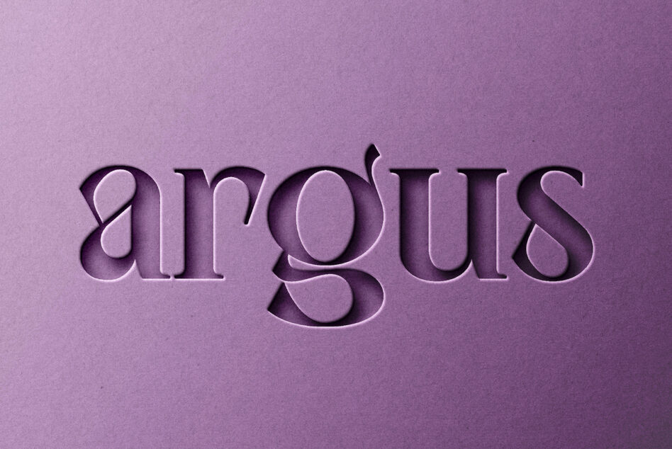 Pressed serif text reading airgoths on mauve paper with engraved effect