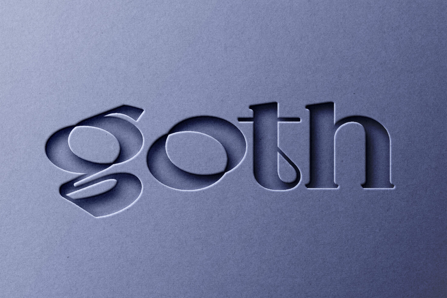 Embossed letters spelling goth on blue textured paper with depth shadow