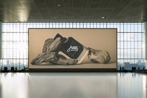 Spacious terminal with large window and billboard displaying minimalist product mockup. Ideal for designers. Key elements: branding mockups urban design.