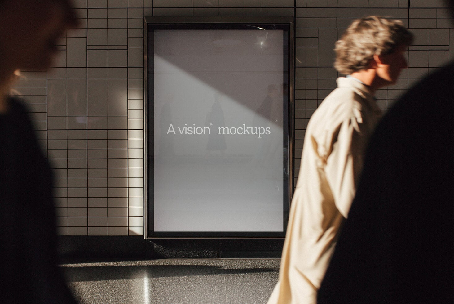 Blank grey screen mockup on subway wall with people walking by