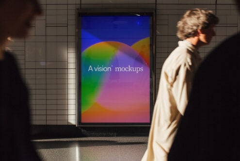 Vibrant rainbow gradient display in tiled subway with commuters in background