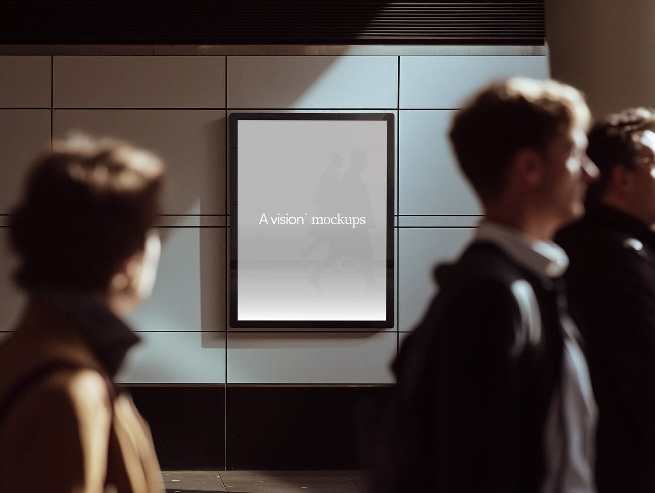 Wall mounted screen with blank white display, people in foreground out of focus