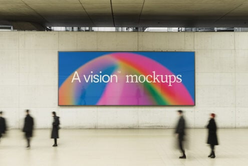Wide display with colorful rainbow gradient, people walking below in lobby