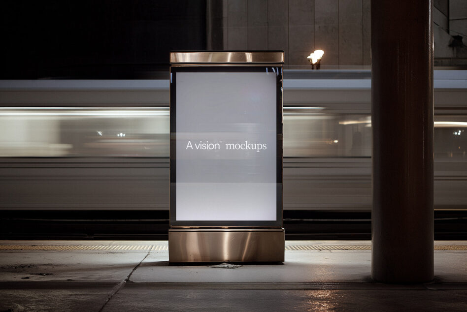 Vertical street kiosk with blank light gray display mounted on steel frame at night