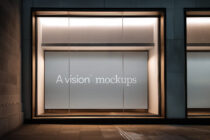 Modern retail window showing neutral display on architectural bronze frame