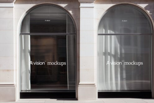 Two matching arched windows with dark interior glass storefront mockup