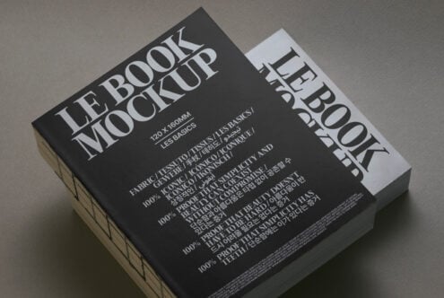 Black book mockup with white spine angled view on neutral surface