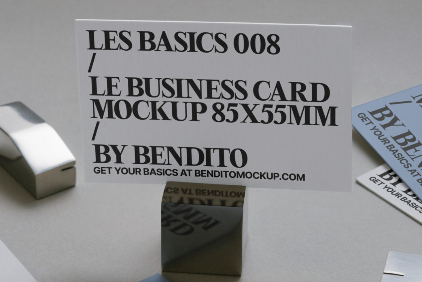 Business card mockup 85x55mm on display stand with scattered printed card variations