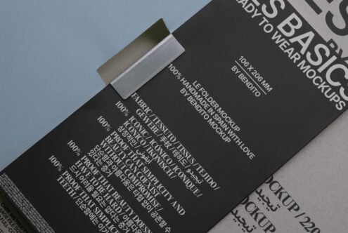 Mockup of a black rectangular folder with white multilingual text fastened with a tape on a minimal background perfect for graphic design presentations.
