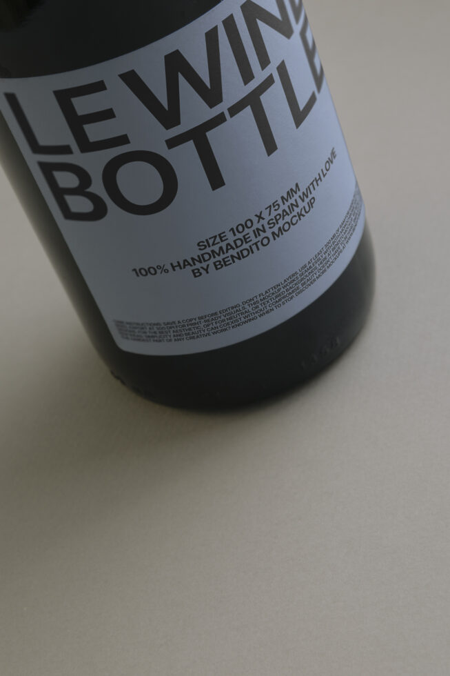 Close-up of wine bottle label mockup with light blue background