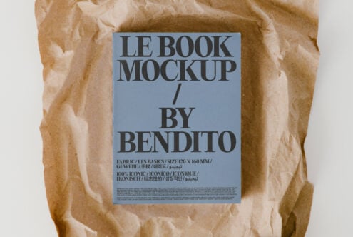 Hardcover book mockup surrounded by wrinkled kraft paper texture