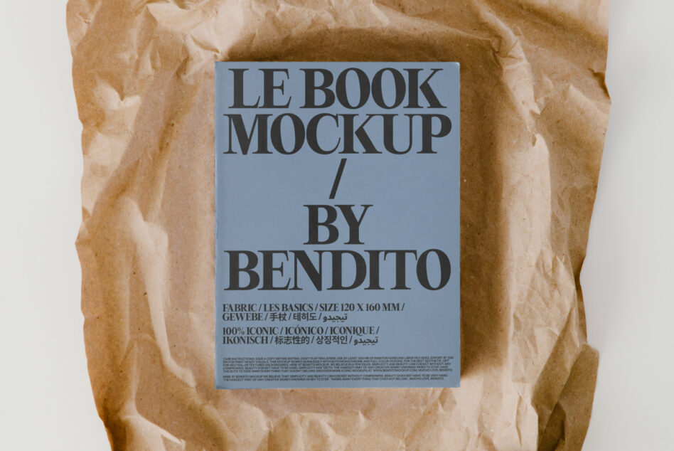 Hardcover book mockup surrounded by wrinkled kraft paper texture