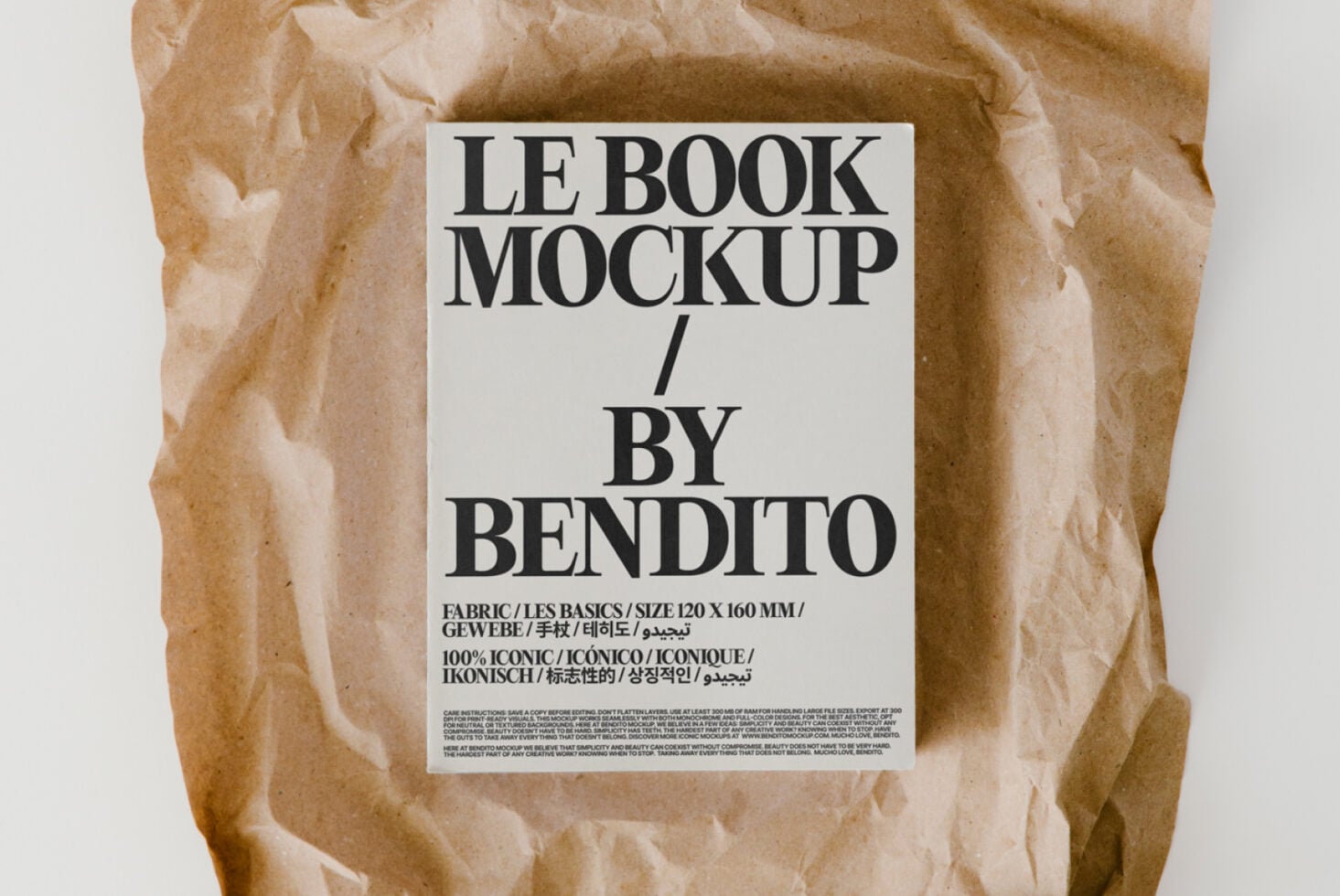 Flat lay of book with white label on crumpled brown paper