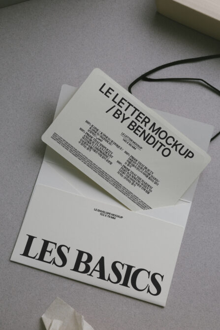 Flat lay of white envelope with letter mockup stacked on folder with black twine