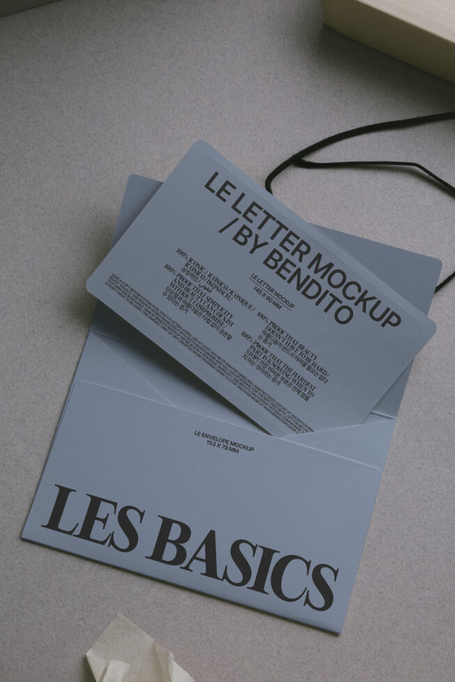 Flat lay of envelope with letter mockup stacked on branded folder with black twine