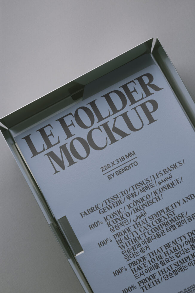 Angled view of folded letter mockup with blue tinted paper inside olive green box