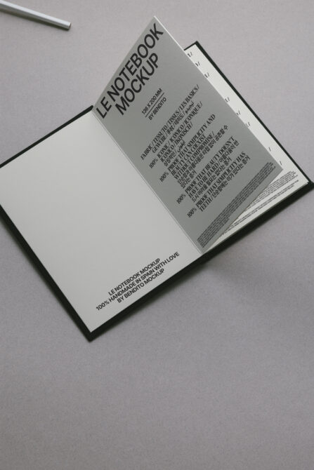 Cream-colored open notebook mockup displaying blank page with visible binding