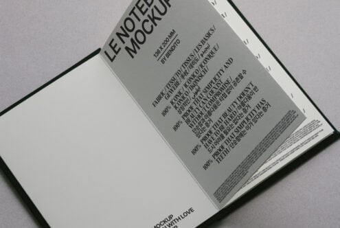 Cream open notebook mockup overhead shot showing text-filled interior pages