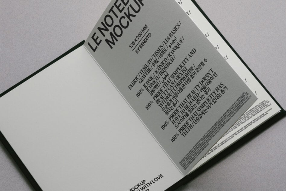 Cream open notebook mockup overhead shot showing text-filled interior pages