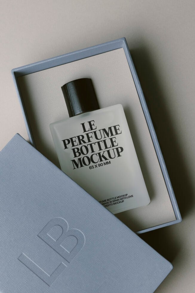 Fragrance bottle mockup inside luxury branded packaging with tissue lining
